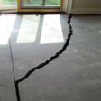 a huge crack in a concrete slab floor in Rockford, IL