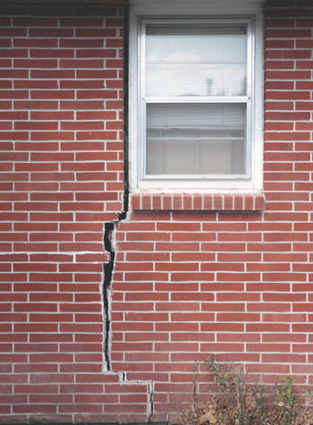 severe foundation wall cracks along a window in Fort Atkins