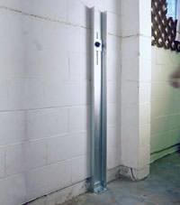 A failing foundation wall repaired with a foundation wall channel anchor system in a Racine home.
