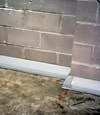 Our baseboard drain system installed on a corner in a West Allis basement.