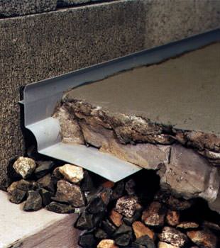a custom designed basement drain system for thin basement floors in Fort Atkins.