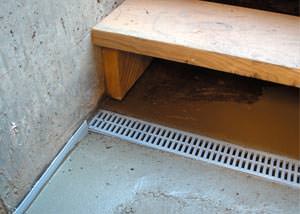a hatchway entrance in Fitchburg that has been protected from flooding by our TrenchDrain basement drainage system.