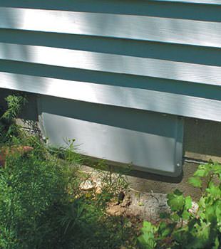 A gray crawl space vent cover in Caledonia