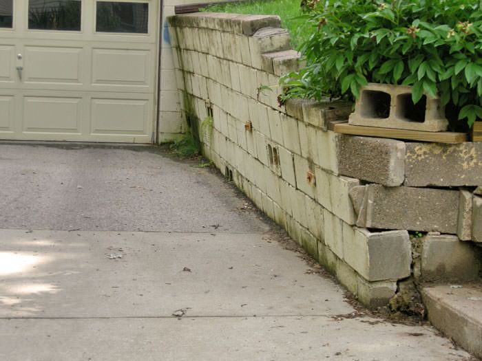 a failing retaining wall around a driveway in Milwaukee