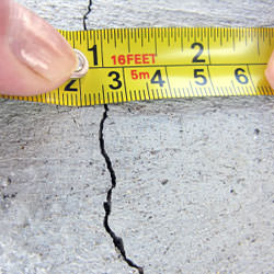 A crack in a poured concrete wall that's showing a normal crack during curing in West Salem