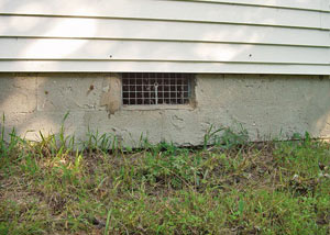 Open crawl space vents that let rodents, termites, and other pests in a home in Menomonee Falls