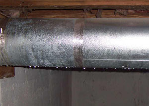 condensation collecting on an HVAC vent in a humid Beloit basement