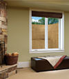 An egress window well installed within a finished basement space in West Allis.